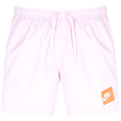 Shop Nike Flow Logo Swim Shorts Pink