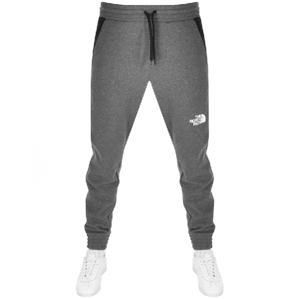 grey north face tracksuit bottoms