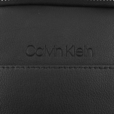 Shop Calvin Klein Silver Flat Crossover Bag Black