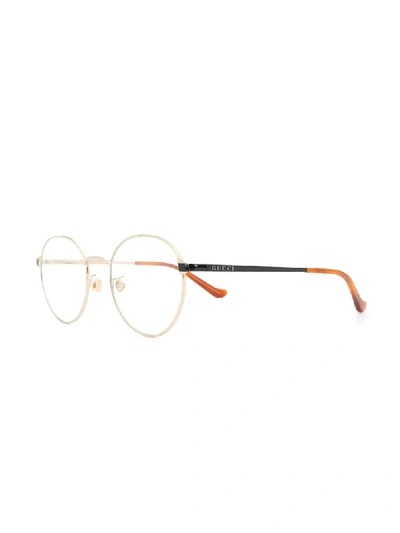 Shop Gucci Round Frame Glasses In Gold