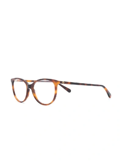 Shop Gucci Tortoiseshell Effect Glasses In Brown