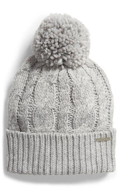 Shop Michael Michael Kors Pompom Cable Knit Beanie In Pearl Heather Grey
