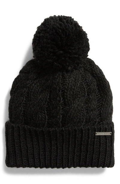 Shop Michael Michael Kors Pompom Cable Knit Beanie In Black/ Hp Silver