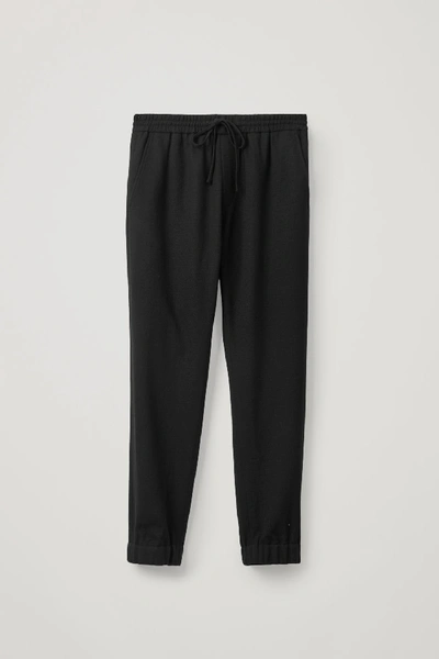 Shop Cos Drawstring Wool Crepe Pants In Black