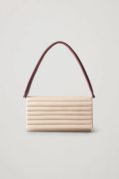 Shop Cos Padded Leather Clutch With Straps In Beige