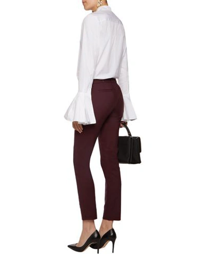 Shop Raoul Pants In Brick Red