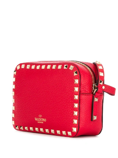 Shop Valentino Rockstud Leather Cross Body Bag In Red