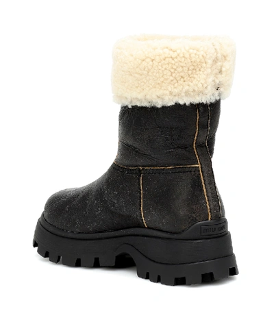 Shop Miu Miu Shearling And Leather Ankle Boots In Black