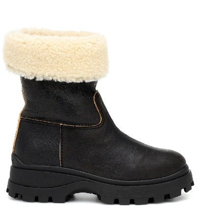 Shop Miu Miu Shearling And Leather Ankle Boots In Black