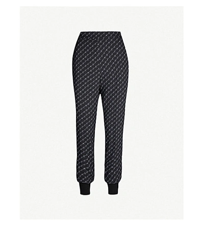 Shop Stella Mccartney Julia Loose-fit Tapered Stretch-crepe Trousers In Black