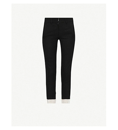 Shop Ann Demeulemeester Contrast-hem Slim-fit Wool And Cotton-blend Trousers In Lain Black Tiriel Cream