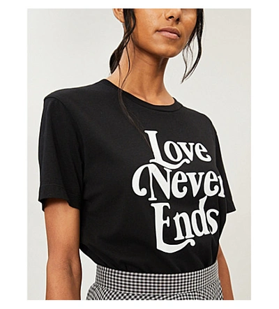 Shop Sandro 'love Never Ends' Slogan Cotton-jersey T-shirt In Black