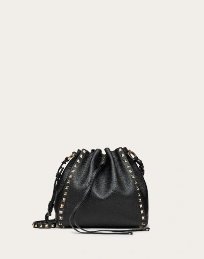 Shop Valentino Garavani Small Rockstud Grainy Calfskin Bucket Bag In Black