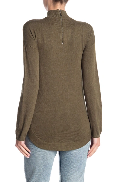 Shop Cyrus Mock Neck Zip High/low Tunic Sweater In Burnt Olive