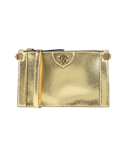 Shop Roberto Cavalli Cross-body Bags In Gold