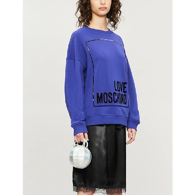 Shop Love Moschino Cropped Metallic Logo-print Cotton-jersey Sweatshirt In Blue