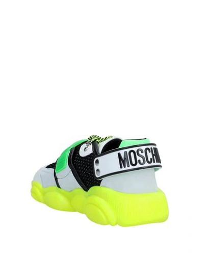 Shop Moschino Sneakers In Green