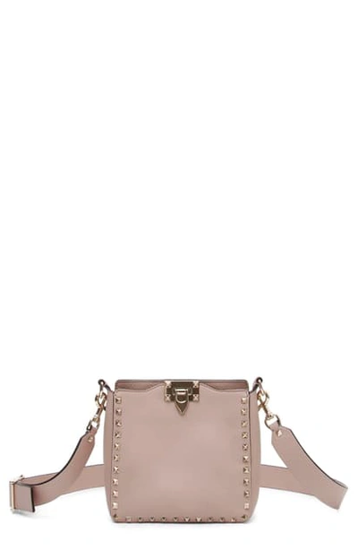 Shop Valentino Rockstud Mini Hobo Crossbody Bag In Poudre Rockstud