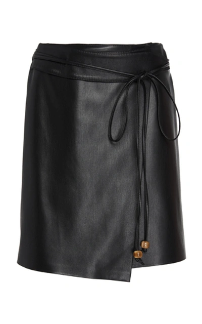 Shop Nanushka Sekoya Faux Leather Wrap Skirt In Black