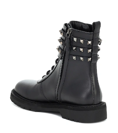 Shop Valentino Rockstud Combat Leather Ankle Boots In Black