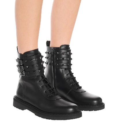 Shop Valentino Rockstud Combat Leather Ankle Boots In Black
