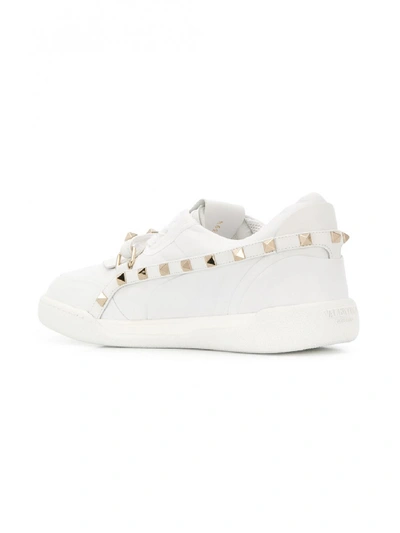 Shop Valentino Rockstud Armor Leather Sneakers In White