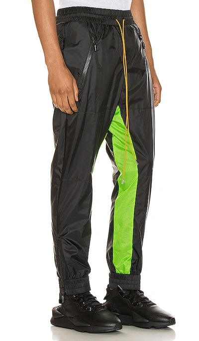 Shop Rhude Flight Suit Pant In Black & Neon Green
