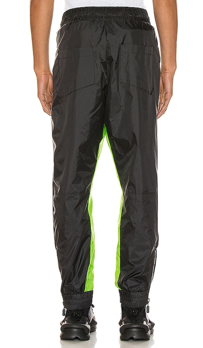 Shop Rhude Flight Suit Pant In Black & Neon Green
