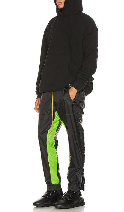 Shop Rhude Flight Suit Pant In Black & Neon Green