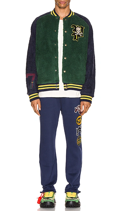 Shop Polo Ralph Lauren Sherpa Varsity Jacket In College Green & Cruise Navy