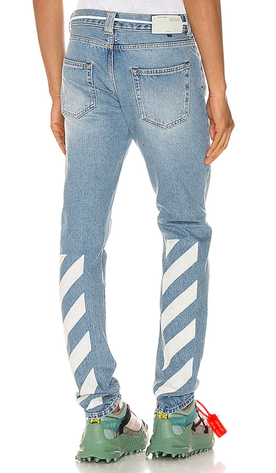 Shop Off-white Diagonal Stripe Slim Jeans In Bleach White