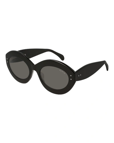 Shop Alaïa Oval Acetate Sunglasses In Nude