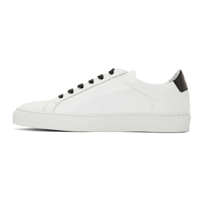 Shop Common Projects White And Black Retro Low Glossy Sneakers In 0547 Wht/bl