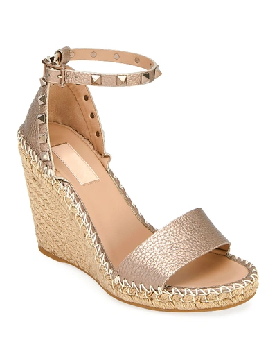 Shop Valentino Rockstud Metallic Wedge Espadrilles In Beige