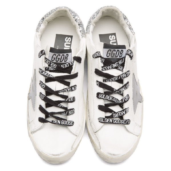 superstar sneakers with silver heel tab with glitter and metal stud lettering