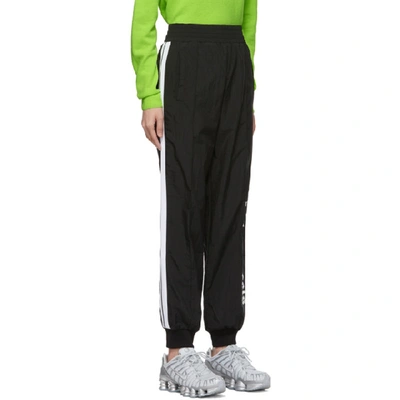 Shop Palm Angels Black Logo Over Track Pants In Black/white