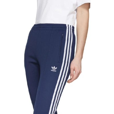 Shop Adidas Originals Blue Sst Track Pants In Dark Blue