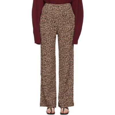 Shop Nanushka Pink And Brown Animal Kisa Trousers