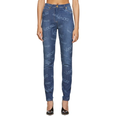 Shop Versace Blue Logo Stamp Jeans In A8806 Denim