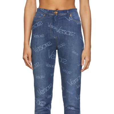 Shop Versace Blue Logo Stamp Jeans In A8806 Denim