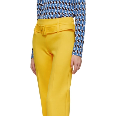 Shop Prada Yellow Ruffled Belted Trousers