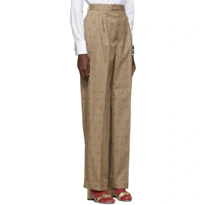 Shop Gucci Beige Pinstripe Gg Trousers In 9702 Beige