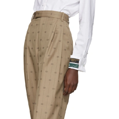 Shop Gucci Beige Pinstripe Gg Trousers In 9702 Beige