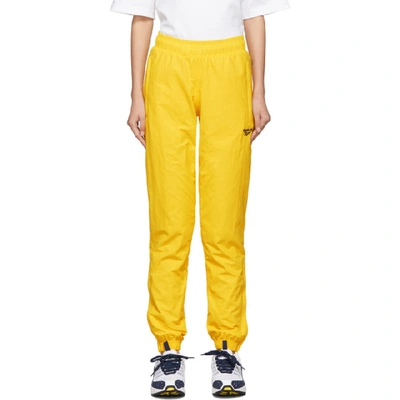Shop Reebok Classics Yellow Vector Track Pants