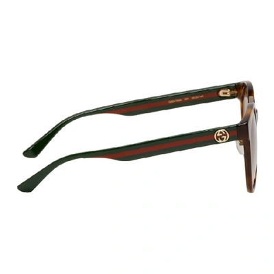 Shop Gucci Tortoiseshell Round Striped Sunglasses
