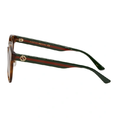 Shop Gucci Tortoiseshell Round Striped Sunglasses