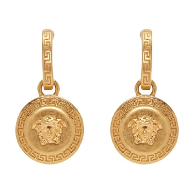 Shop Versace Gold Medusa Tribute Pendant Earrings In Kot Gold