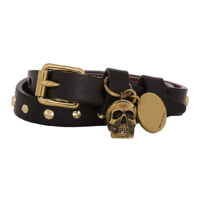 Shop Alexander Mcqueen Black And Gold Wrap Stud Skull Bracelet In 1000 Black