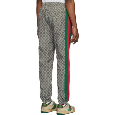 Shop Gucci Brown Nylon Gg Oversized Lounge Pants In 4350grnred