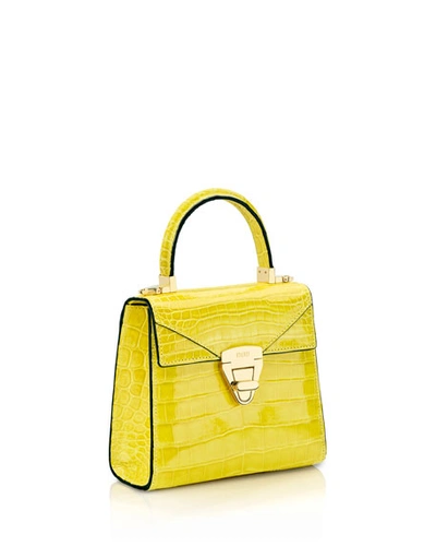 Shop Stalvey Mini Trapezoid Crocodile Top Handle Bag, Yellow In Light Yellow